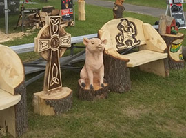 Cross and Pig Chainsaw Carvings